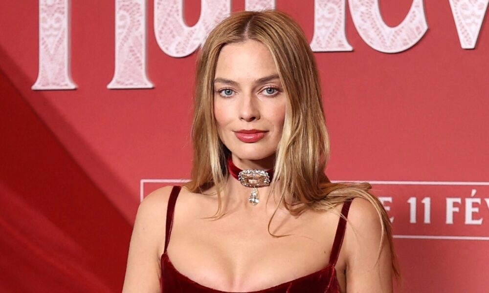 Margot Robbie Dazzles in 100 Carats of Rare Diamonds and Feathered Velvet  Chanel Gown in Paris